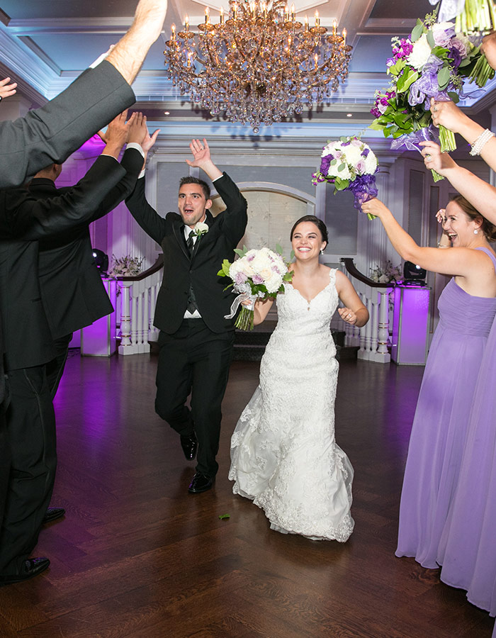 bride and groom entering the ballroom